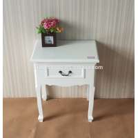 White wooden bedside table with one drawer